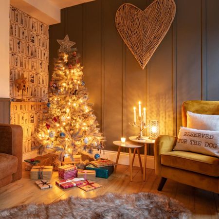 A brightly lit Christmas tree in a cosy living room