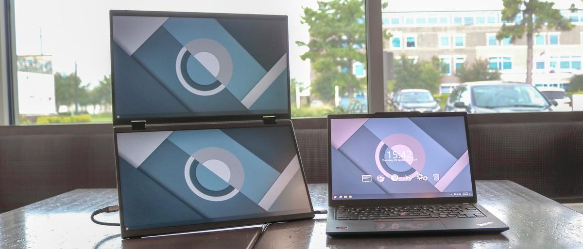 The UPERFECT Delta dual screen portable monitor connected to a laptop on a table