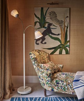 Living room with an ottoman upholstered in antique textiles. The colors in the fabric has been used to create the color palette of the room