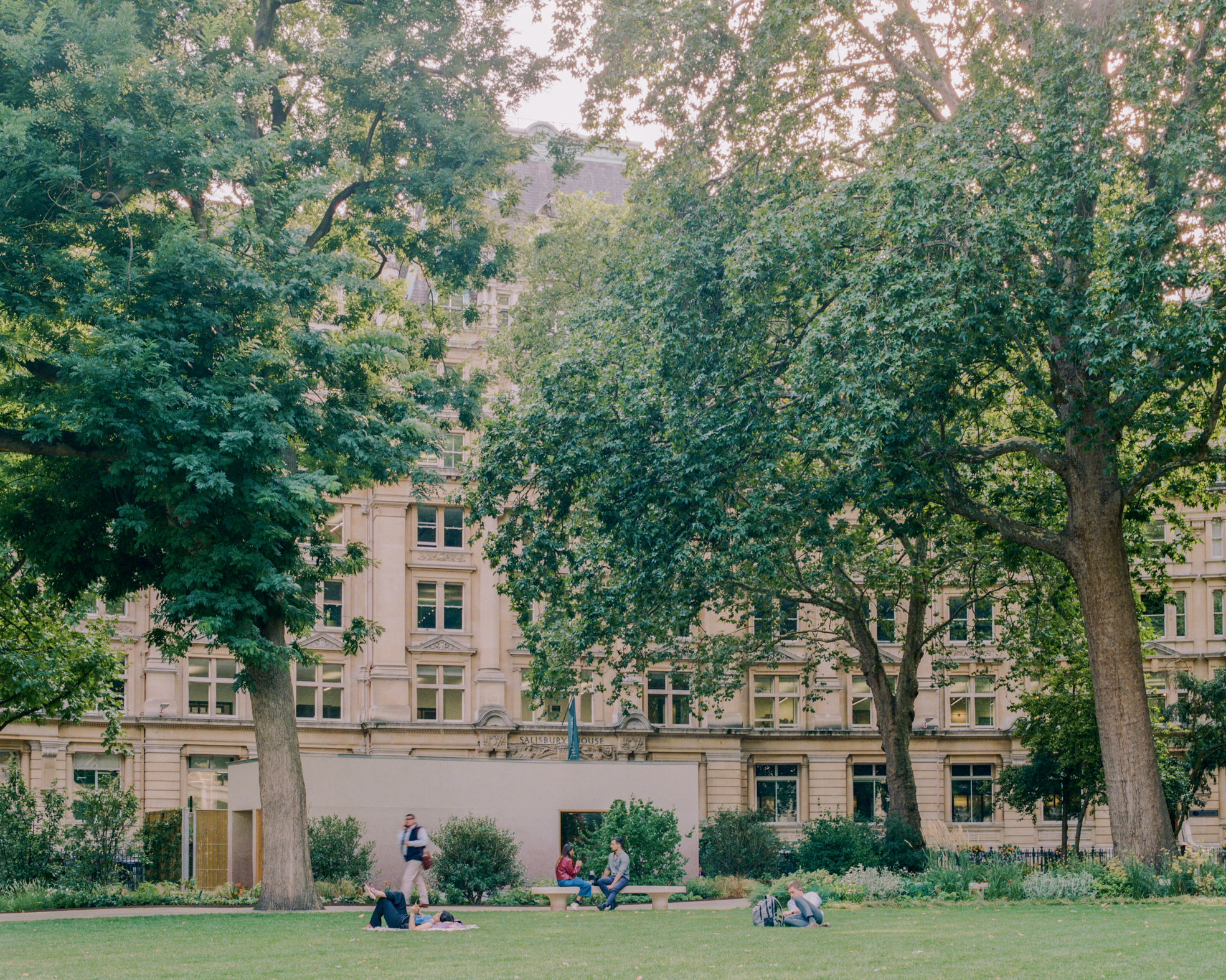view of Finsbury Circus Parks Office, a minimalist, earthy building set among leafy garden