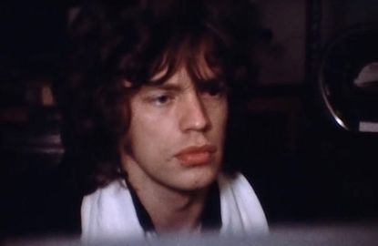 Mick Jagger watches an audience member killed right in front of him, caught on film