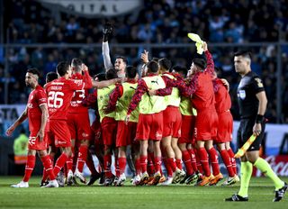 Independiente players celebrate after winning a derby against Racing Club in September 2023.