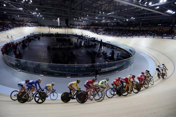 Cyclists race during the inauguration ceremony of the Saint-Quentin-en-Yvelines Velodrome in Montigny-le-Bretoneux
