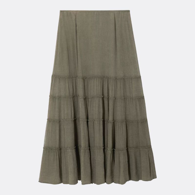 A cut out of a khaki tiered maxi skirt on a pale background