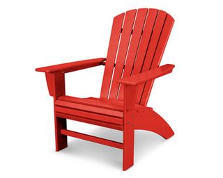 A bright red plastic Adirondack chair