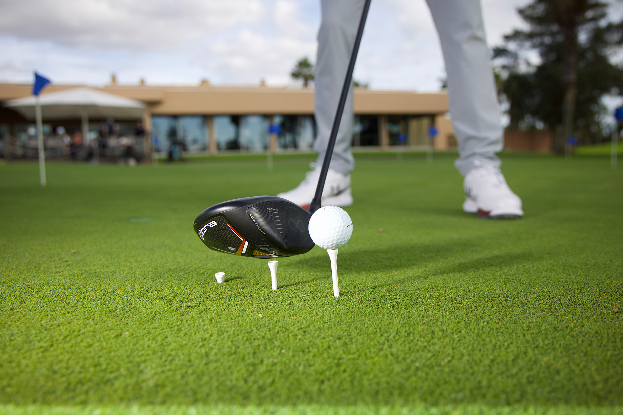 The step drill with three tees in the ground at increasing heights towards the end one, with the golf ball on it, encouraging a shallower angle of attack and eradicating the over the top swing