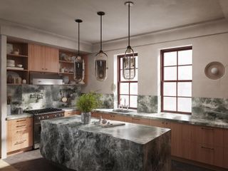 A kitchen with limewash walls and veined marble island