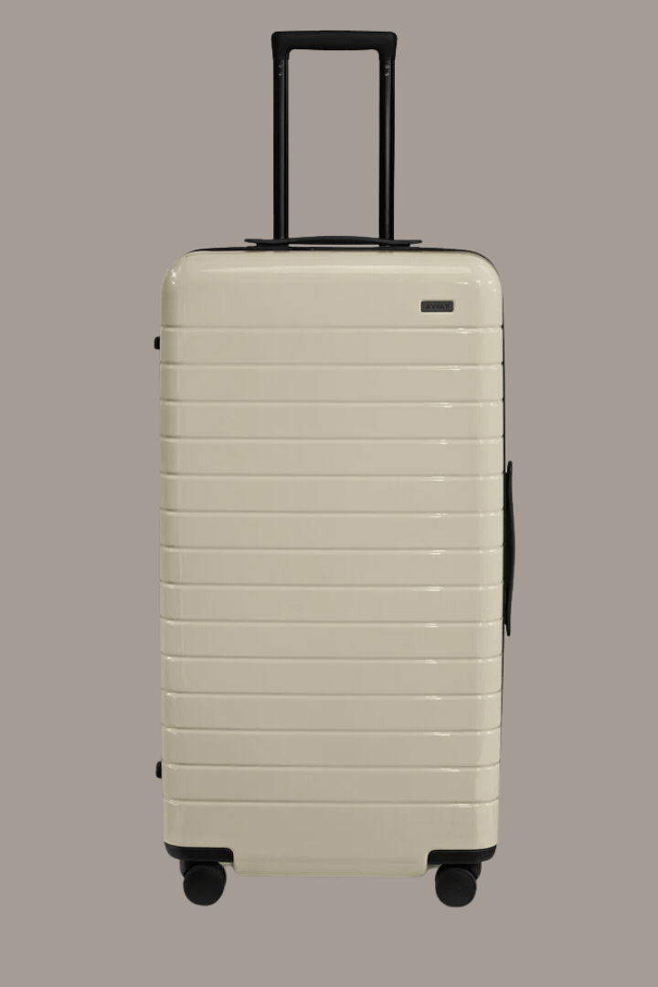 The Trunk in Salt White (Gloss) in a rotating gif that sees it standing and sitting open against a brown background.