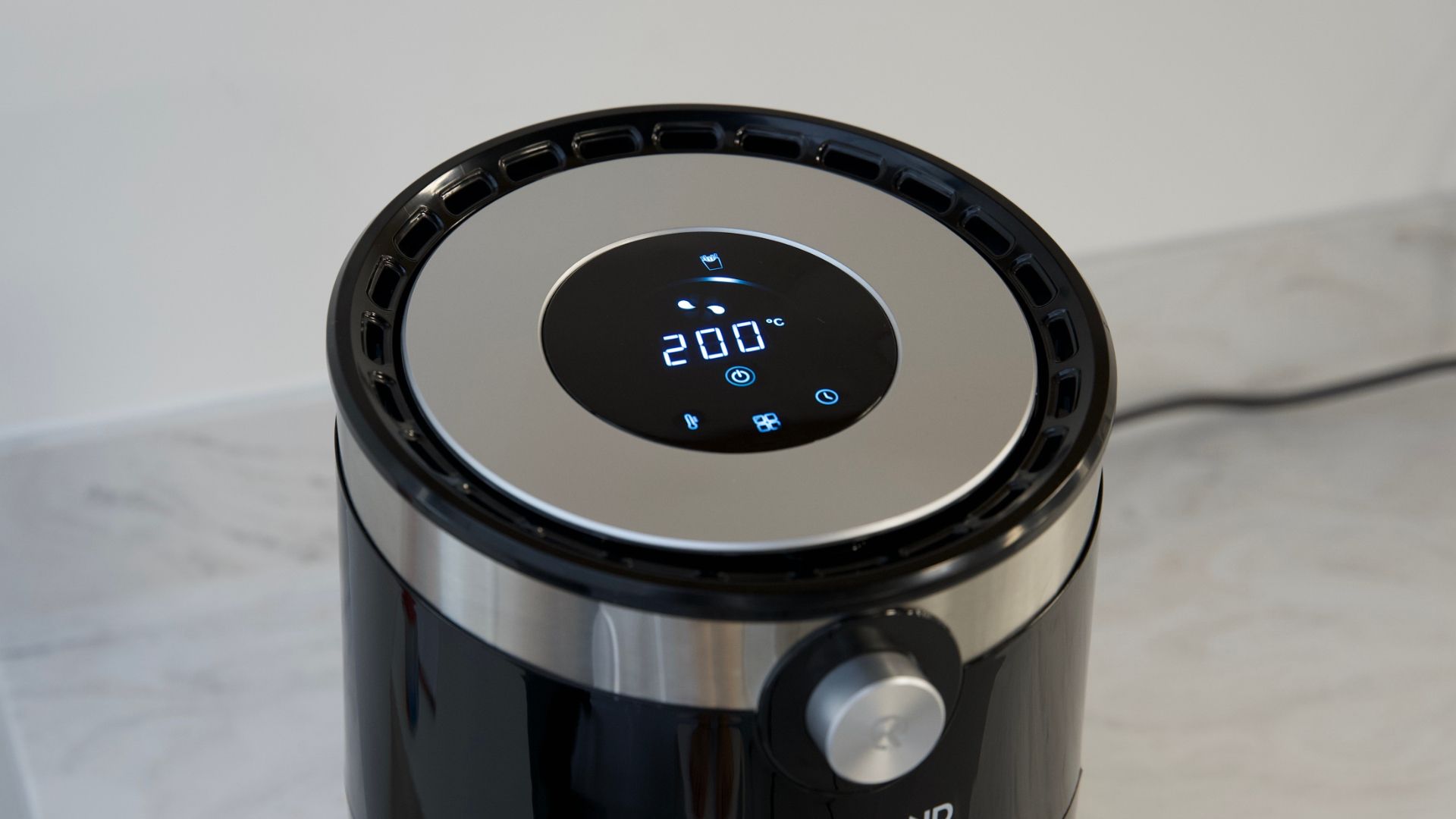 Top of the air fryer to show display screen to follow instruction to make how to use an air fryer easier