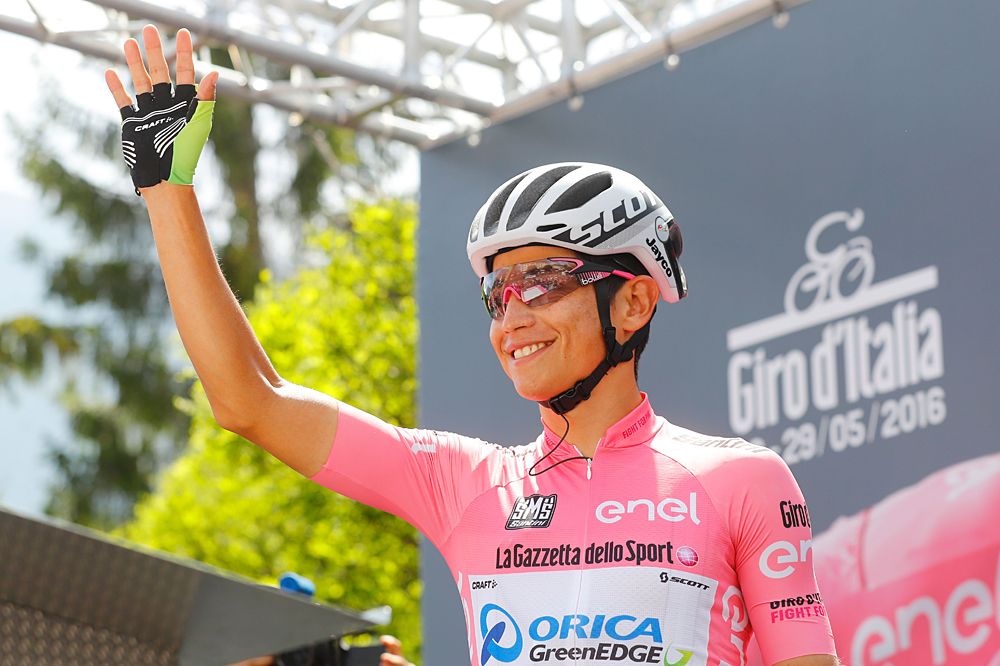 Maglia rosa Esteban Chaves (Orica-GreenEdge) waves to the crowd at the start of stage 20 Giro d'Italia