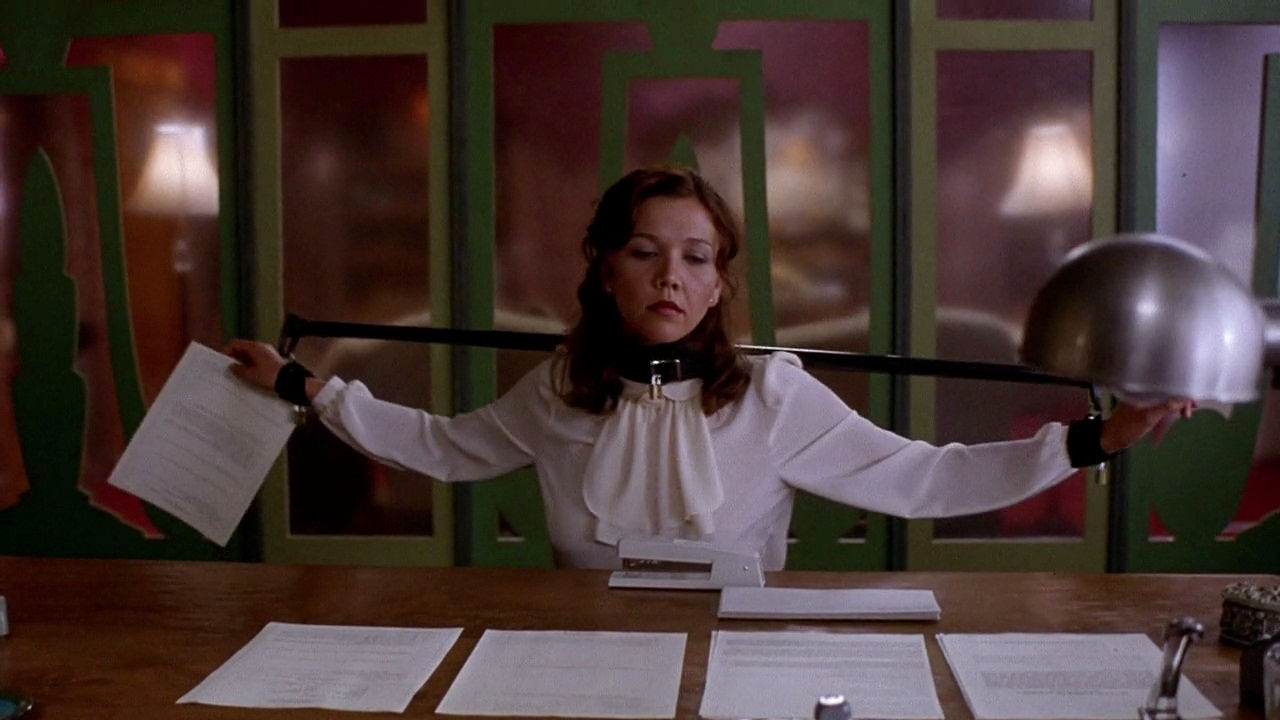 Maggie Gyllenhaal wearing restraints in Secretary