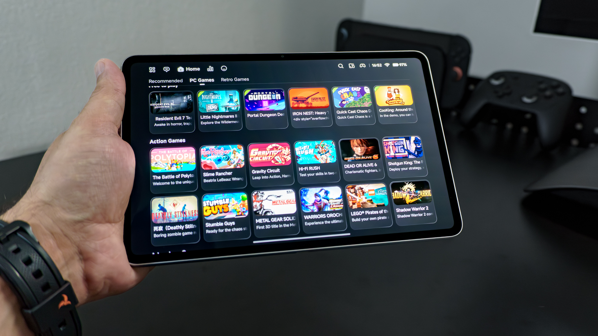 A person holding the RedMagic Astra 2 showing off all of the compatible PC games via emulation in RedMagic's GameHub app