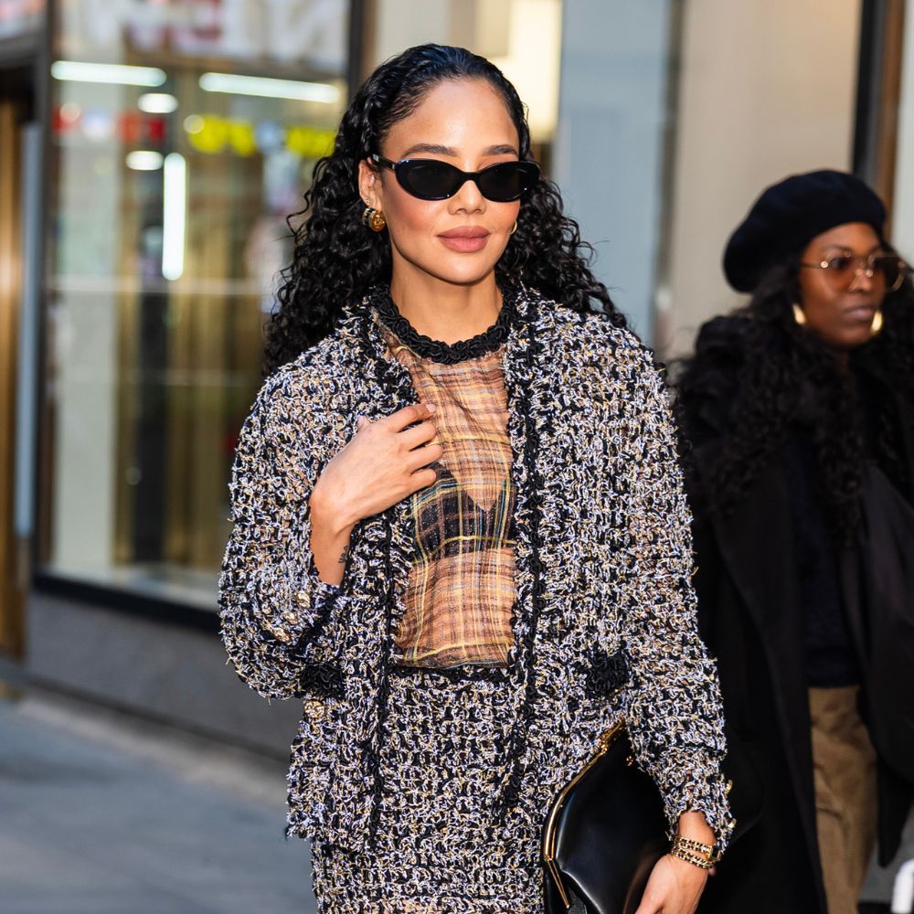 Tessa Thompson wears dipped toe Chanel heels with a tweed skirt suit set and dipped-toe heels.