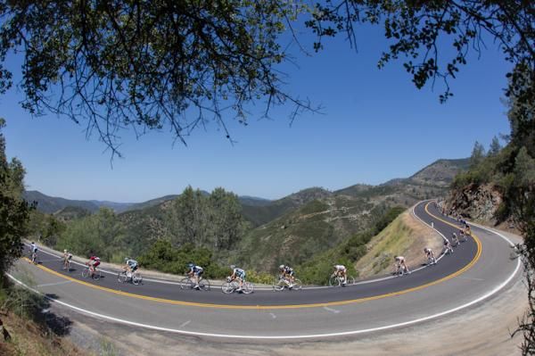 Photographers stack up waiting to get past the peloton.