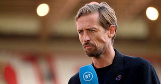 Peter Crouch, BT Sport pundit is seen wearing the Premier League Rainbow Laces pin badge prior to the Premier League match between Nottingham Forest and Liverpool FC at City Ground on October 22, 2022 in Nottingham, England.