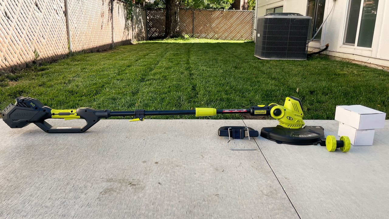 Sun Joe 24V-ST14 Cordless String Trimmer being tested in writer's home