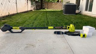 Sun Joe 24V-ST14 Cordless String Trimmer being tested in writer's home