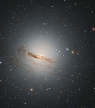 Hubble spotted this lenticular galaxy, a cross between a spiral and elliptical-shaped galaxy, known as NGC 1947. The galaxy, which was originally discovered over 200 years ago, can only be viewed from the southern hemisphere and can be found in the Dorado (Dolphinfish) constellation about 40 million light-years away from Earth.