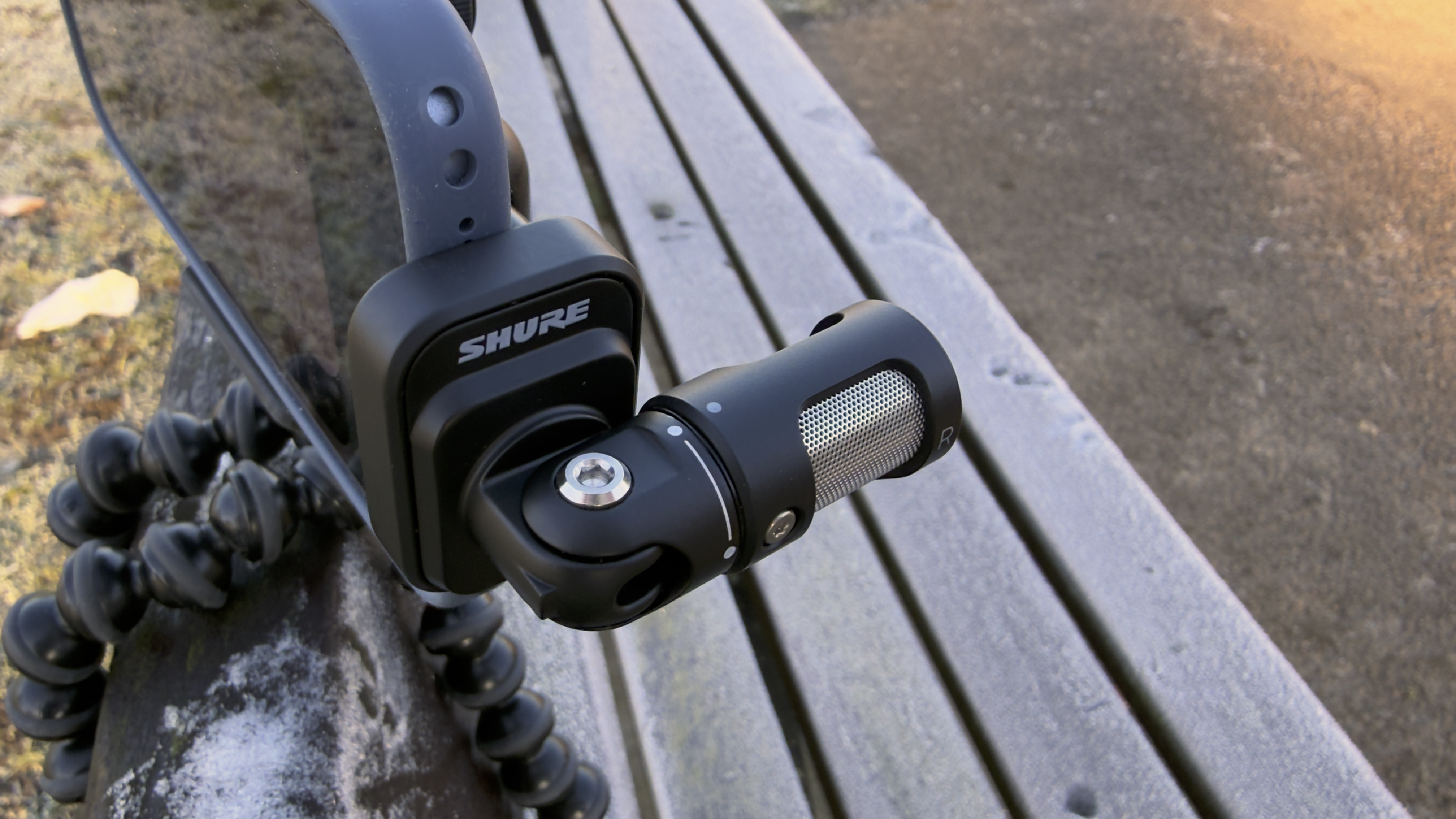 Shot of the mic plugged into a landscape-oriented iPhone 17. It&amp;rsquo;s hinge has been adjusted 90&amp;ordm;, so that it&amp;rsquo;s pointing at a subject behind the iPhone