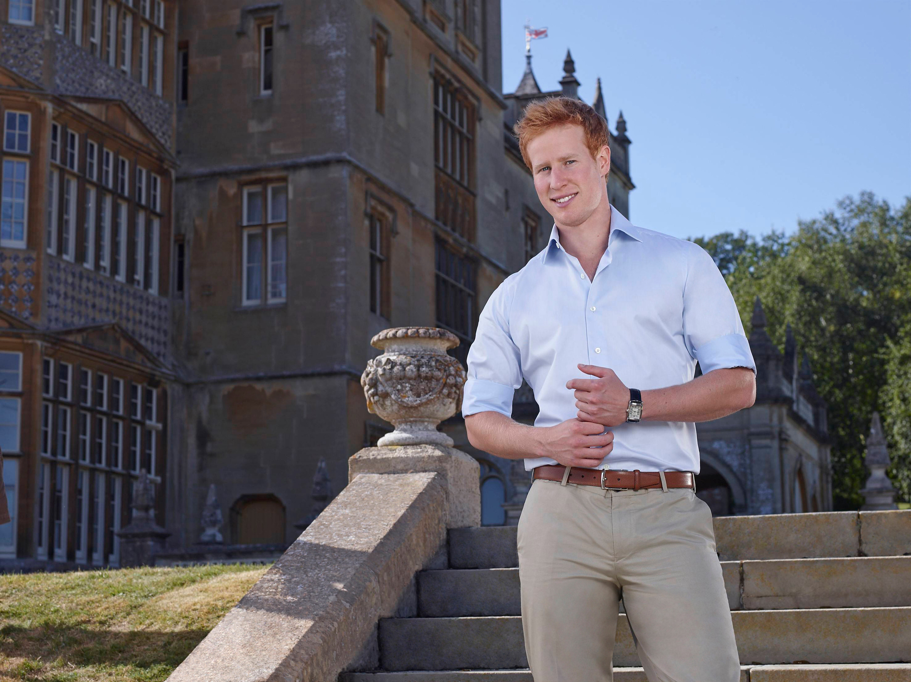 prince harry wears a blue shirt and khakis standing outside a castle in 'I Wanna Marry 'Harry''
