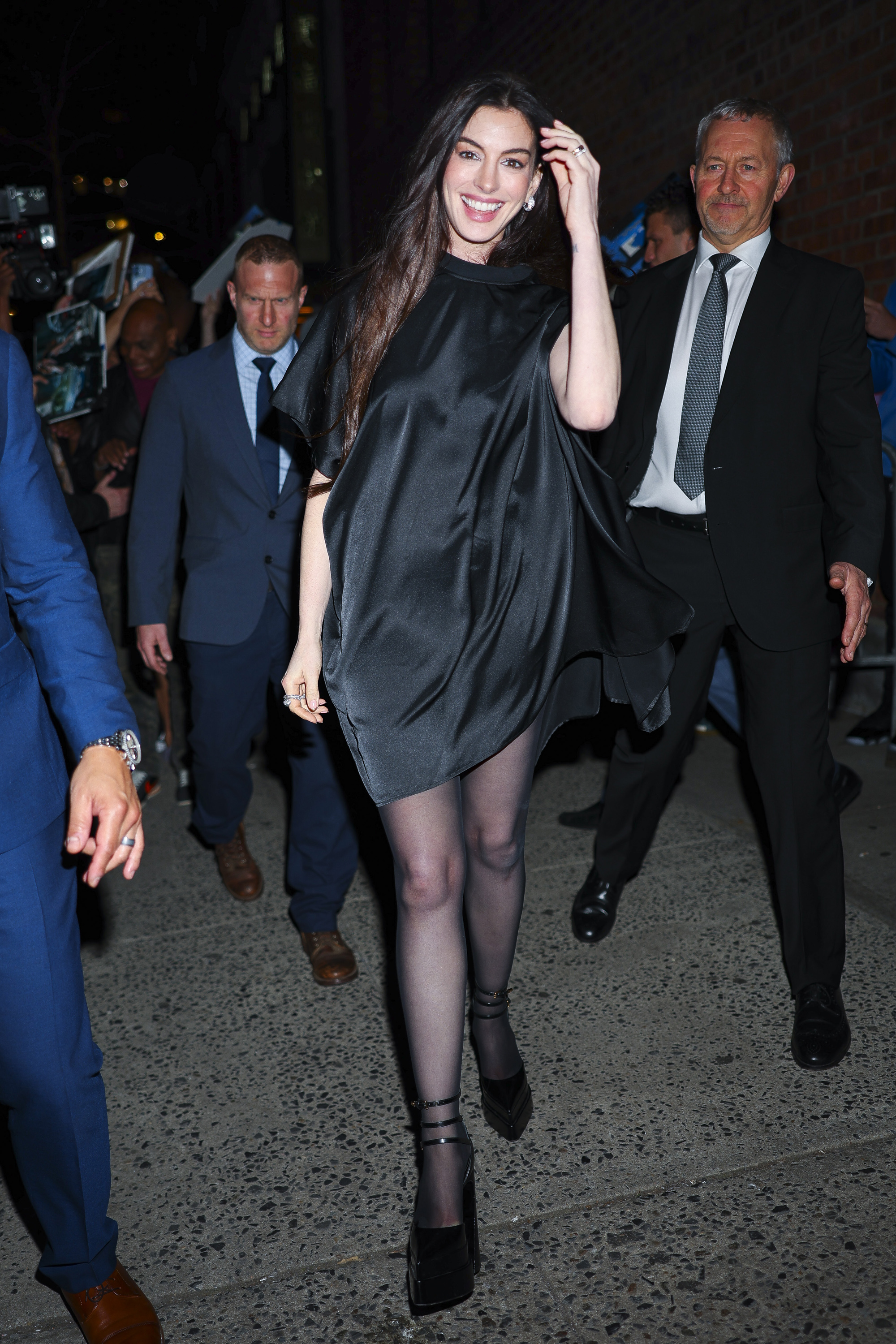 Anne Hathaway wore a black satin mini dress to the Mother Mary after party