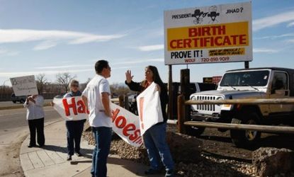 People argue over a Colorado birther billboard that stirred up controversy in 2009: Would the conspiracy theories persist, ask pundits, if Obama were white?