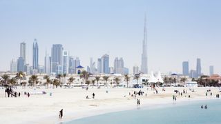 a beach and city shot of UAE