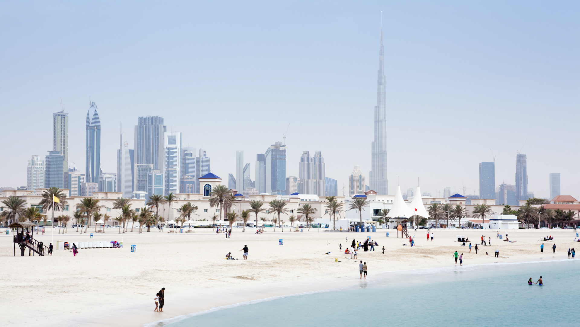 a beach and city shot of UAE