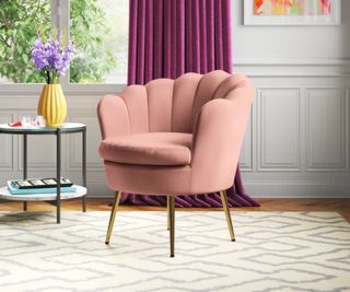 Etta Avenue Barrel Chair on a rug in a traditional dining room with painted wood pannels and a purple curtain in the background