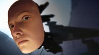 An artificial woman's face on the end of a mechanical limb