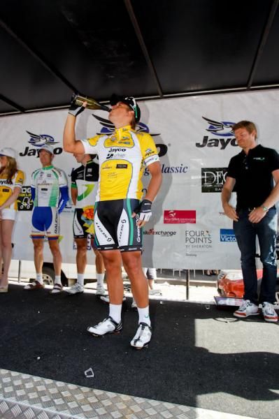 Allan Davis takes a sip of the bubbly after taking out the 2012 Joyco Bay Cycling Classic.