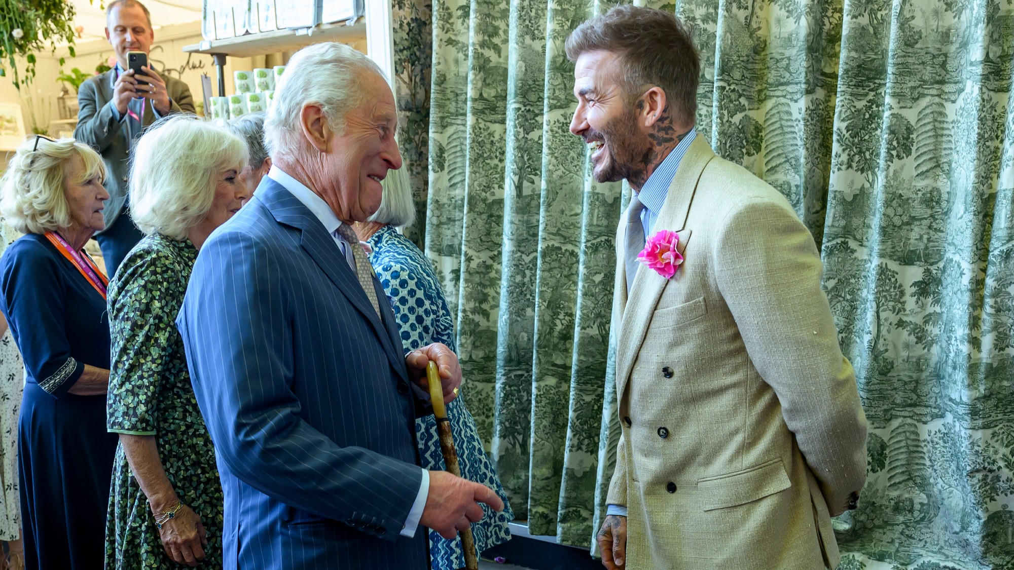 David Beckham laughing with King Charles