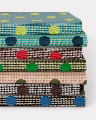 the fabrics merge houndstooth and polka-dot patterns