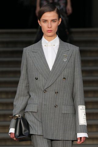 A model at Erdem SS25 wearing structured hair, a key Spring/Summer 2025 Fashion Month Beauty Look