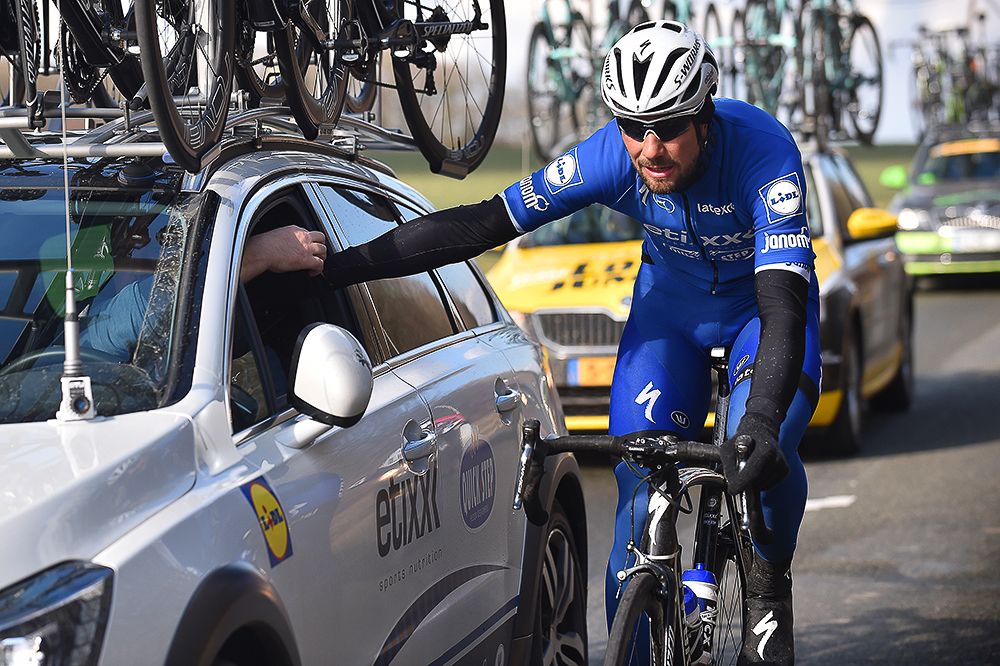 Etixx-QuickStep's Tom Boonen spends some time with the team car.