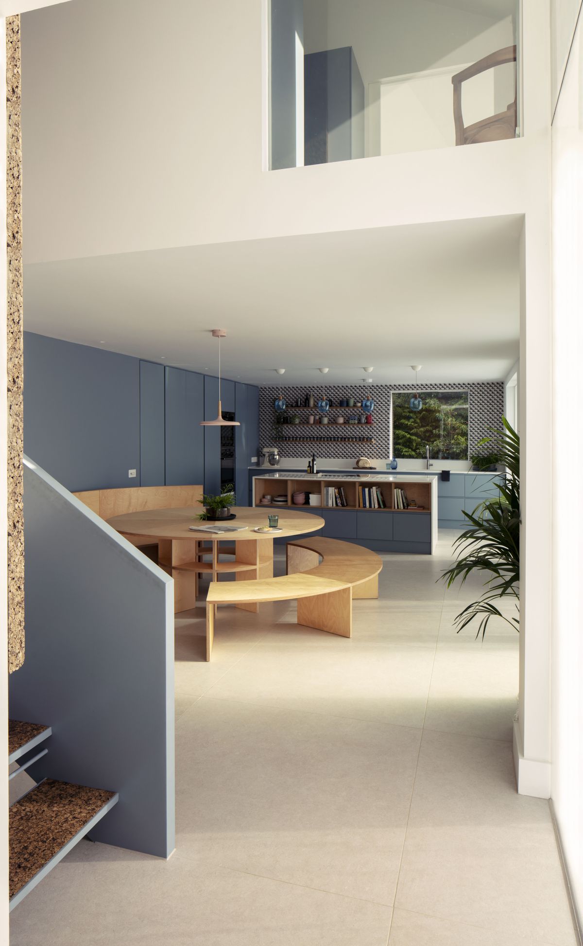 open plan kitchen and dining area with staircase