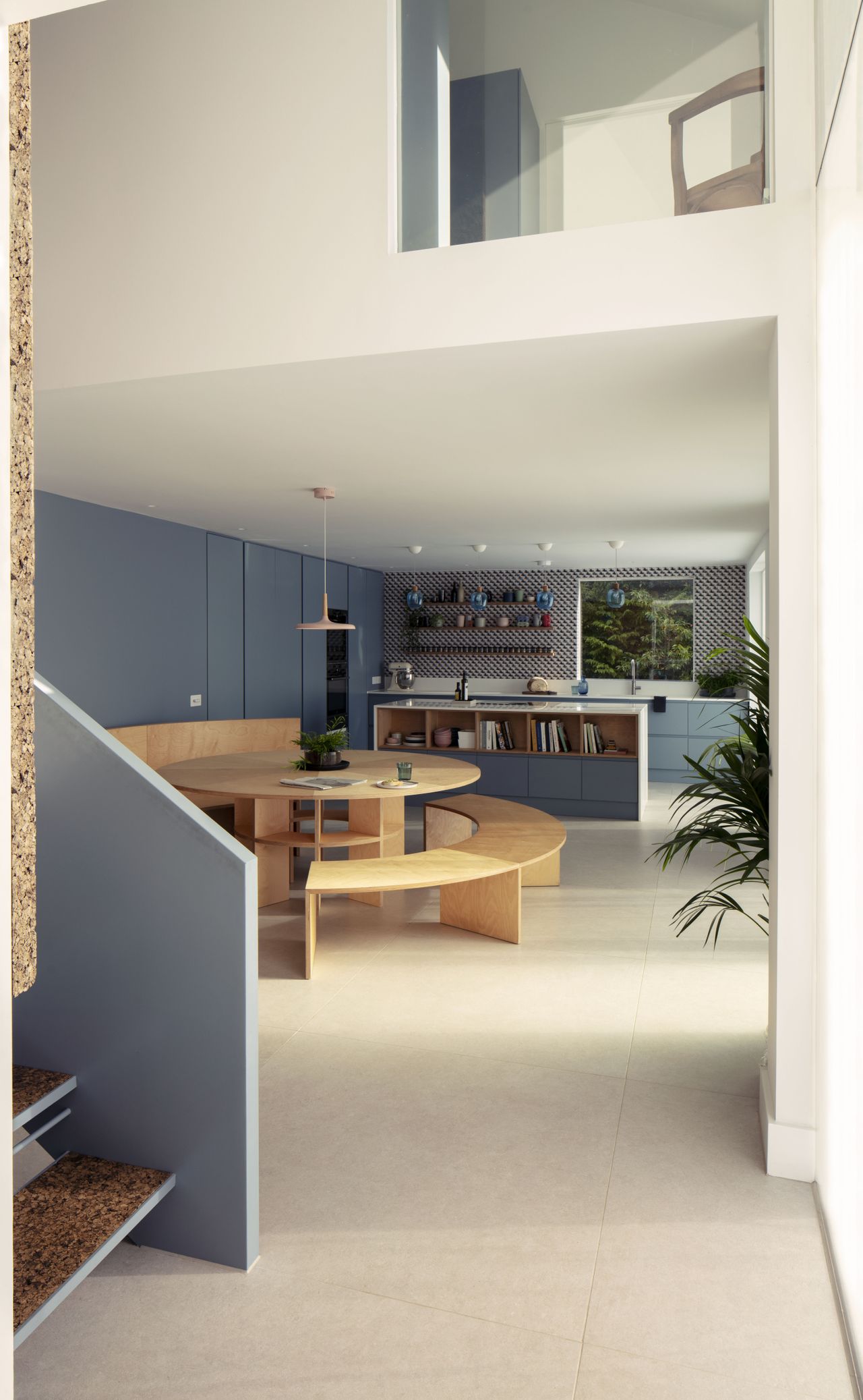 open plan kitchen and dining area with staircase