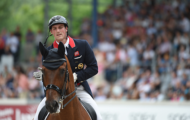 Michael Eilberg praises Marakov after their freestyle at Aachen 2016. Picture by Peter Nixon