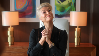 Hannah Waddingham with her hands together on her desk as Rebecca in Ted Lasso Season 4