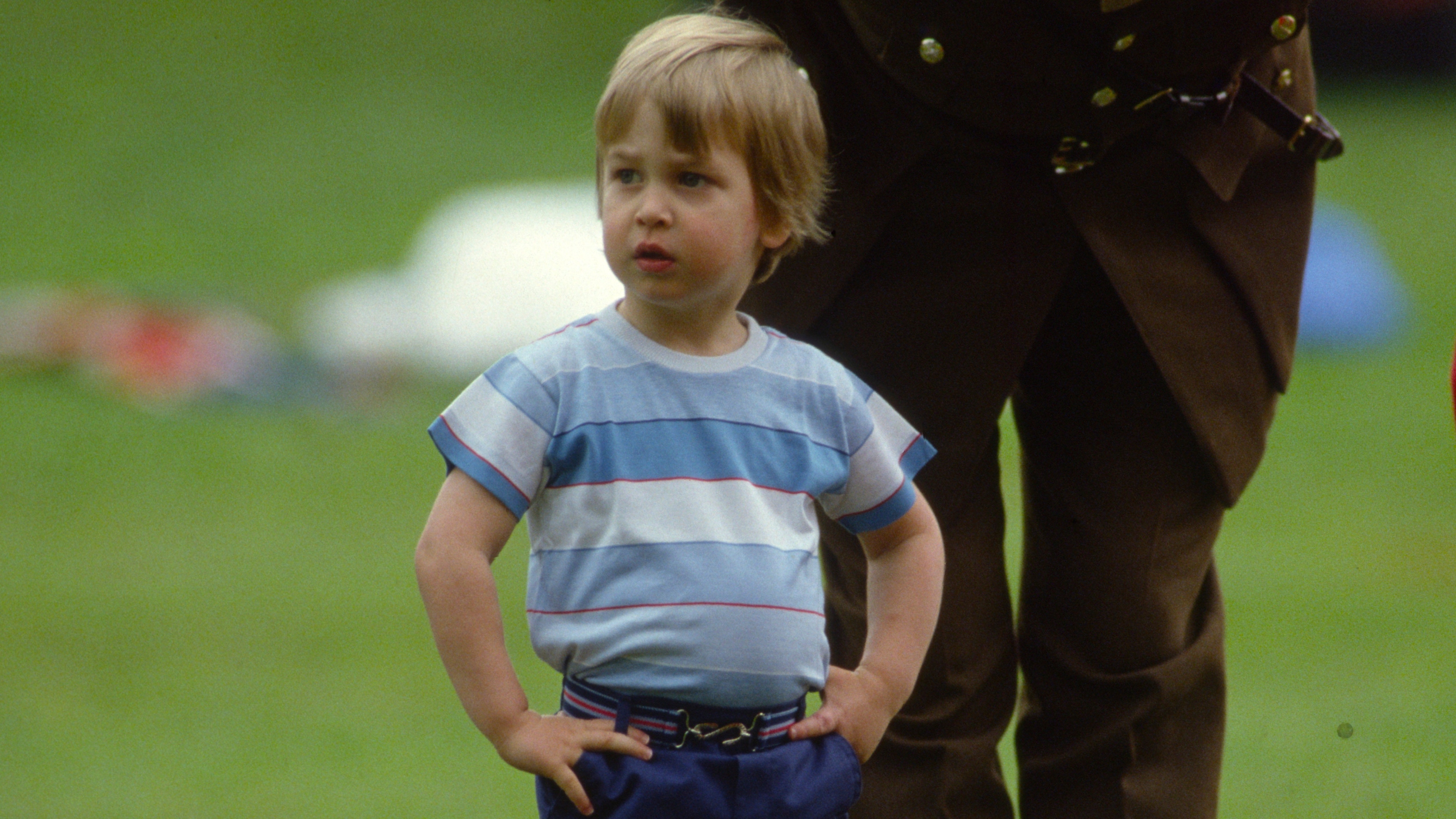 Prince William stands in the Kensington Palace grounds to watch a display by the Red Devils in 1983