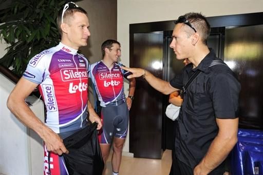 Silence-Lotto's Sebastian Lang (L) speaks to teammate Philippe Gilbert in the team's hotel lobby. Gilbert resides in Monaco but is not part of Silence-Lotto's Tour de France squad.