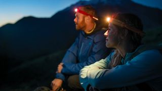 Two hikers wearing BioLite HeadLamp 330 headlamps