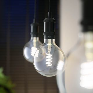 close up of the Philips Hue smart lighting filament bulbs