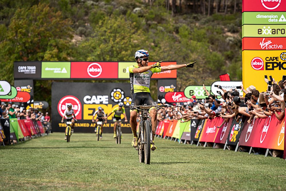 Matthys Beukes of Pyga Eurosteel crosses the line first to win the stage during stage 5 of the 2019 Absa Cape Epic Mountain Bike stage race