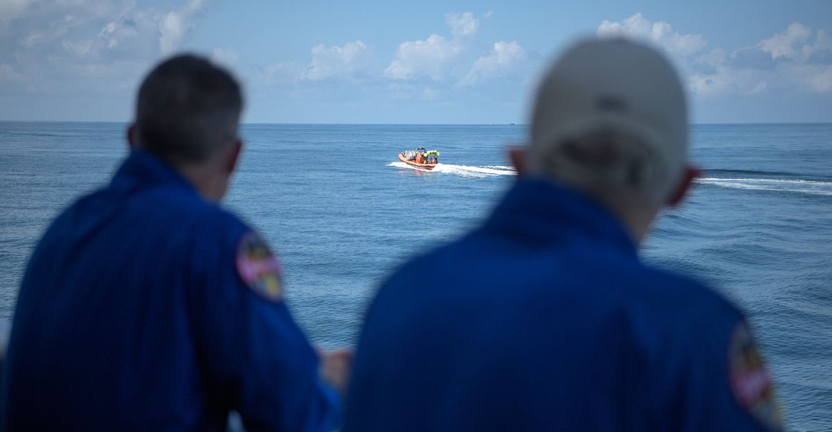 NASA astronaut and Crew Recovery Chief Shane Kimbrough, left, and NASA Chief Astronaut Pat Forrester watch as SpaceX support teams are deployed on fast boats from the SpaceX GO Navigator recovery ship ahead of the landing of the SpaceX Crew Dragon Endeavour spacecraft with NASA astronauts Robert Behnken and Douglas Hurley onboard, Sunday, Aug. 2, 2020 in the Gulf of Mexico off the cost of Pensacola, Florida.