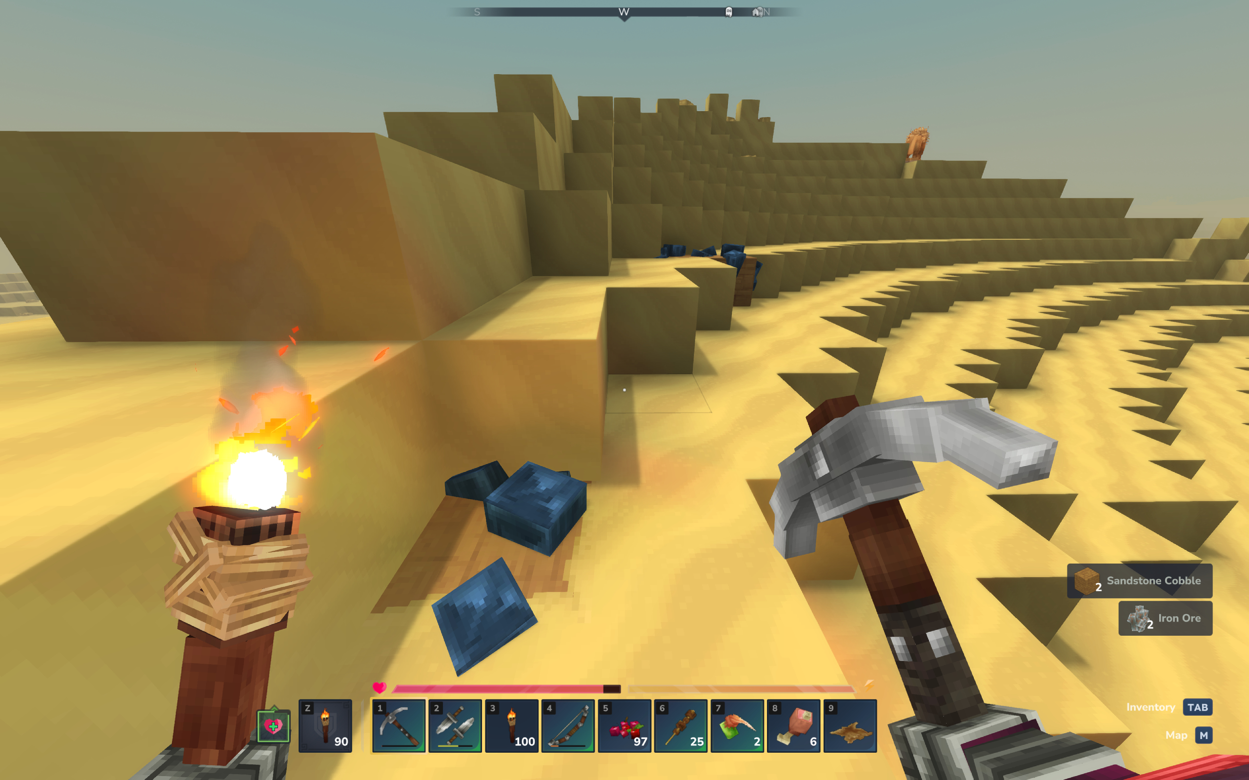 Hytale cobalt: A player looking at cobalt ore deposits in a desert, holding a pickaxe and torch.