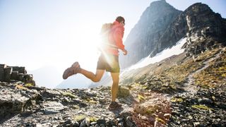 Person running on mountain trail