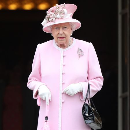 Queen Elizabeth in a pink coat and hat
