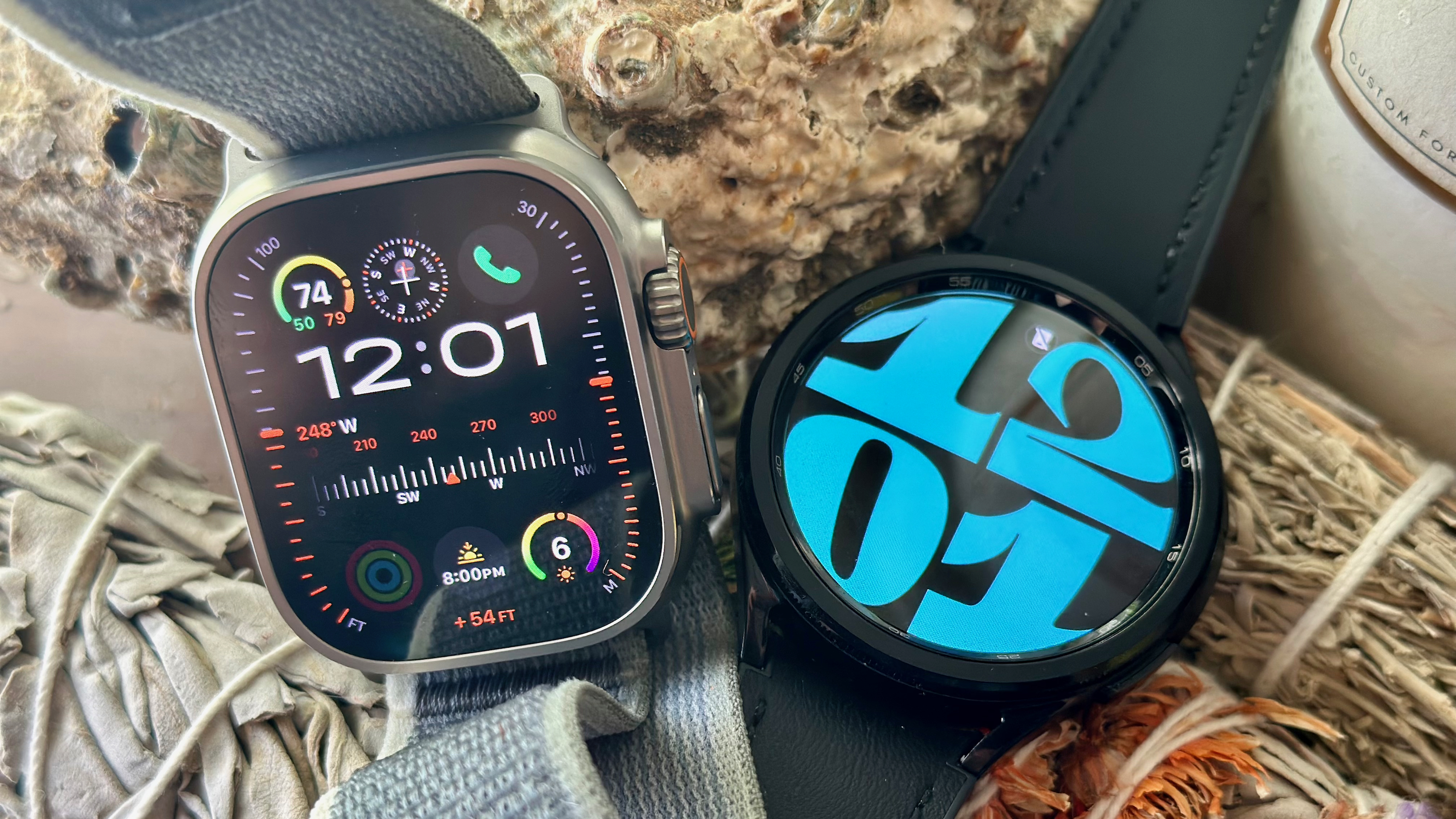 The Apple Watch Ultra 2 (left) and Samsung Galaxy Watch 6 Classic (right) side-by-side