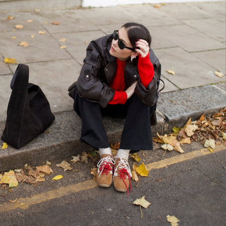 Influencer Alice Satterthwaite wearing suede trainers.